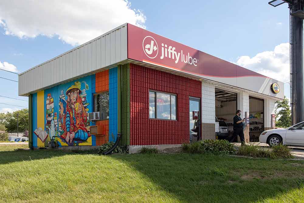 Colorful mural on side of Jiffy Lube
